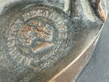 a close up of a piece of pottery with a design on it