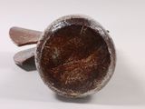 a wooden spoon and a wooden spoon rest on a white surface