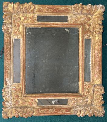 a mirror that is sitting on a green surface