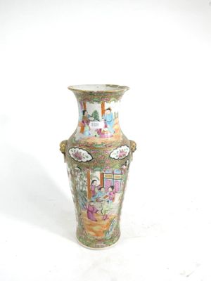 a vase that is sitting on a white surface