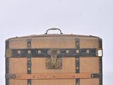 an old suitcase sitting on top of a white surface