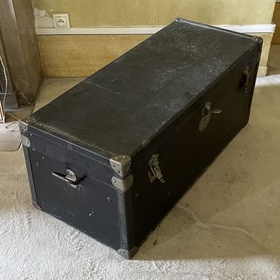 a black suitcase sitting on the floor in a room