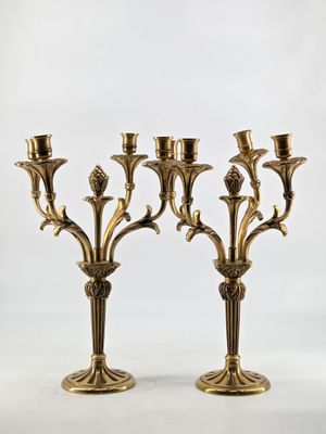 pair of antique brass candelabs with flowers and leaves