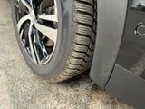 a close up of a tire on a car