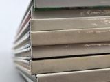 several books stacked on top of each other on a table