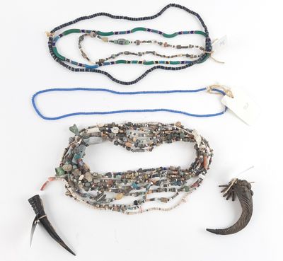 several pieces of jewelry are laid out on a white surface