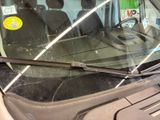 a car that has a windshield that has a sticker on it