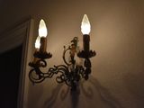 two lights that are on the wall in the room