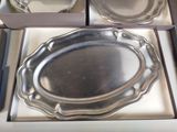 a silver plate in a box on a table