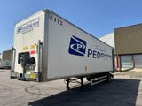 a semi truck that is parked in a parking lot