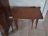 a small table and a small table on a tiled floor