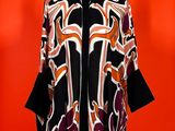an image of a woman ' s jacket on a mannequin