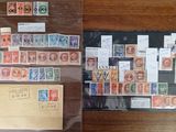 many different stamps on display in a glass case