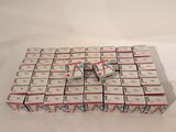 boxes of cigarettes stacked on top of each other on a white surface