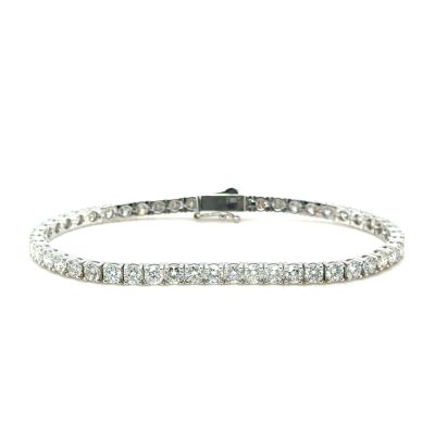 a diamond tennis bracelet on a white background