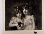 a black and white photo of two young girls holding a cat