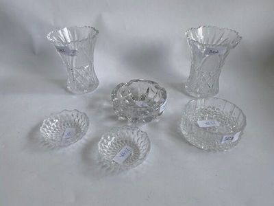 five pieces of glass sitting on a white surface