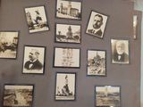 an old photo of a person holding a book with pictures on it