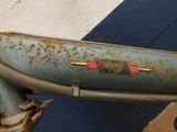 a close up of a bike with rust on the handlebars