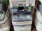 several dust machines are stacked on top of each other in a room
