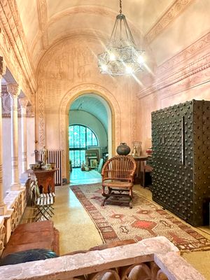 a large room with a lot of furniture and a chandelier
