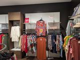 a picture of a clothing store with a variety of clothes
