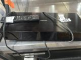 a remote control sitting on top of a black box