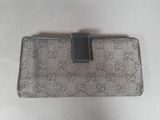 a close up of a purse on a table with a white background