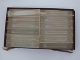 a brown box with a bunch of glass items inside of it