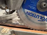 a close up of a circular saw blade on a table