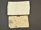 two pieces of cloth with a drawing of a man on it