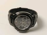 a watch that is sitting on a white surface