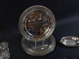 a silver plate with a mirror on top of it