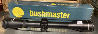 a bushmaster scope sitting on a table next to a box