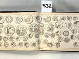un vieux livre couvert de timbres