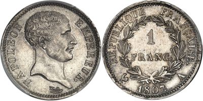 a close up of a coin with a man ' s face on it