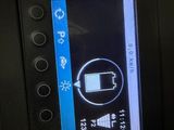 a close up of a cell phone on the dashboard of a car