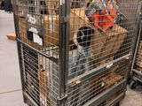 a large metal cage with a bunch of items in it
