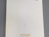 a close up of a white paper with a yellow star on it