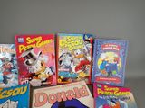 a lot of children ' s books that are on the table