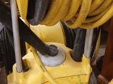 a yellow hose that is connected to a yellow machine