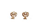 a pair of gold earrings with a key on them