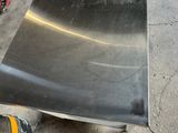a piece of metal sitting on top of a piece of metal