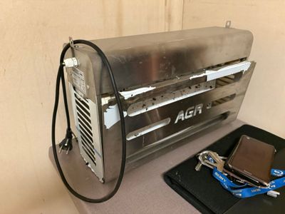 a toaster that is sitting on a counter next to a wallet