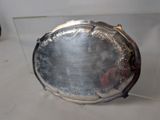 a silver tray with a mirror on it on a table
