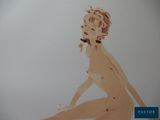 a drawing of a nude woman sitting on the floor