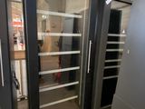 a glass door that is open in a building