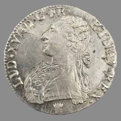 une pièce d'argent portant une tête de femme et une couronne