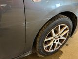 a close up of a car ' s tire with a sticker on it