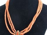 a close up of a necklace on a mannequin mannequin